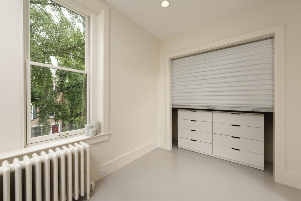BOWA design build row home renovation in Washington, DC Baby Room Closet with Rolling Door | Contemporary / Modern